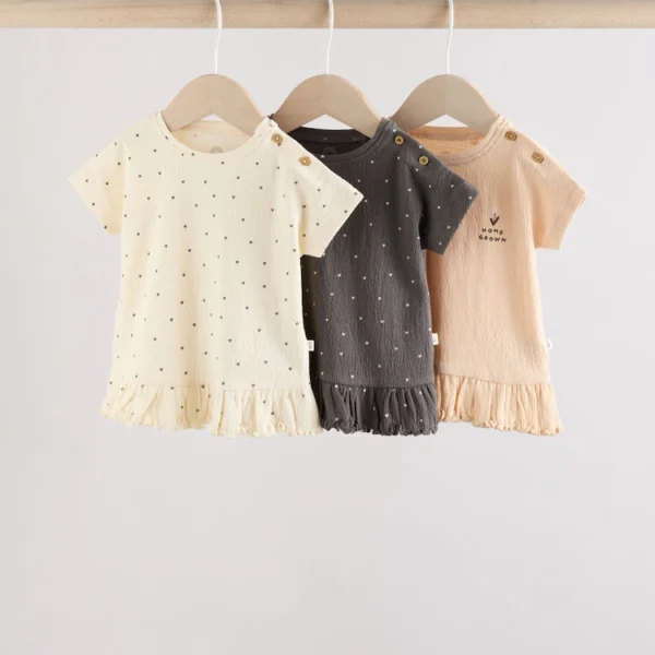 Three-pack of baby jersey short-sleeve tops in cream and charcoal spot designs